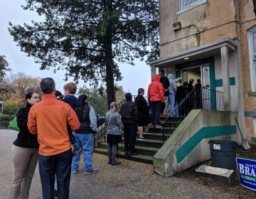 People wait in line to vote just after 7 a.m. at the Local 135 union hall on Sandy Street in Norristown, Montgomery County. (Katie Colaneri/WHYY)