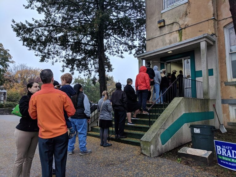 People wait in line to vote just after 7 a.m. at the Local 135 union hall on Sandy Street in Norristown, Montgomery County. (Katie Colaneri/WHYY)