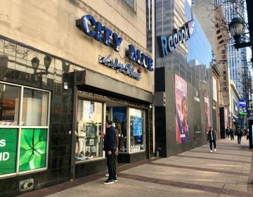 Shoppers gaze into the window of City Blue in Center City Philadelphia (Darryl C. Murphy/WHYY).