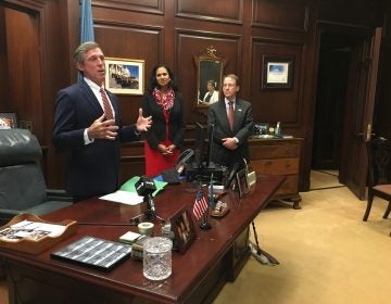 Delaware Gov. John Carney talks about soaring health care costs before signing an executive order in his Wilmington office. (Mark Eichmann/WHYY)