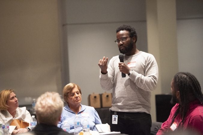 Daryl Murphy recaps his table's discussion topic at the conclusion of the event. (Jonathan Wilson for WHYY)