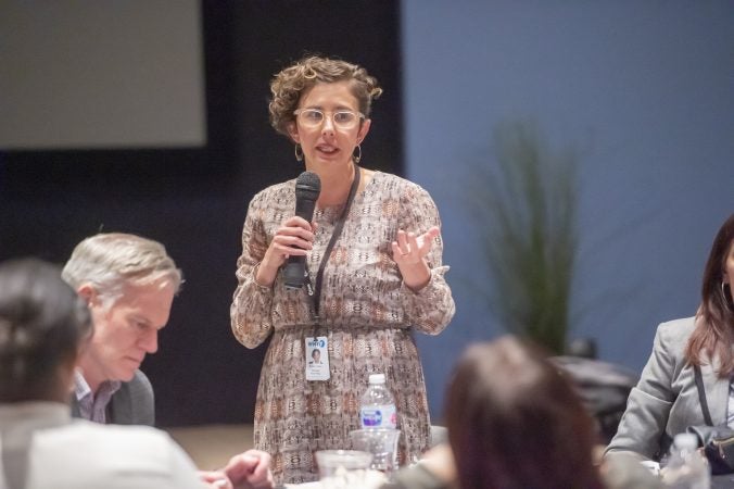 WHYY's Ariella Cohen recaps her tables discussion topic at the conclusion of the event. (Jonathan Wilson for WHYY)