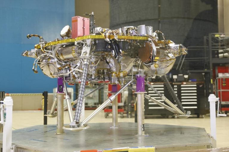 Once NASA's InSight Mars lander enters the Martian atmosphere and approaches the planet's surface, propulsive landing gear will slow the spacecraft down to about 5.5 mph (8.8 km/h) and safely set it down on the surface of the Red Planet. This image, taken at Lockheed Martin Space in Littleton, Colorado, shows several of the critical landing systems including the thrusters, lander legs and science deck. (NASA)