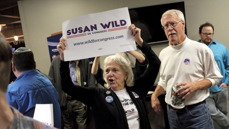 A supporter of Susan Wild, Democratic candidate for Pennsylvania's new 7th Congressional District, celebrates a victory in the race during an Election Night event Nov. 6, 2018, at Coca-Cola Park in Allentown, Pennsylvania. (Matt Smith for WHYY)