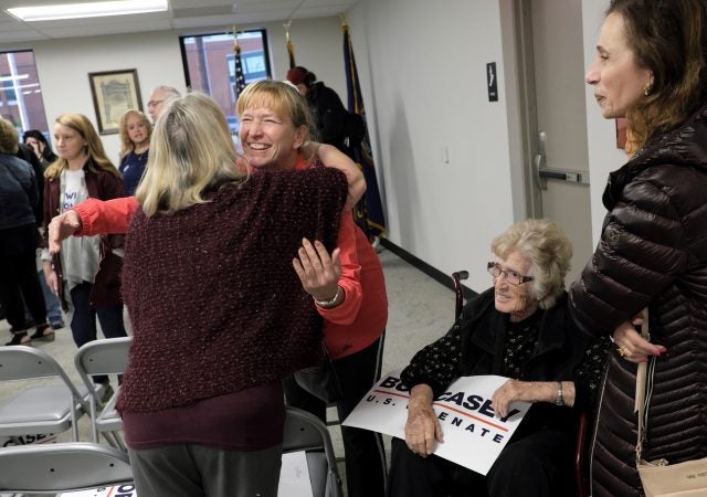 A supporter hugs Susan Wild, Democratic candidate for Pennsylvania's new 7th Congressional District, after a rally featuring Senator Bob Casey on Nov. 4, 2018, at local IBEW in Allentown, Pennsylvania. (Matt Smith for WHYY)