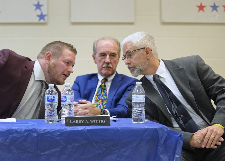 Tamaqua Area School District meeting regarding arming of teachers and staff Tamaqua School board member Nicholas Boyle, left, and School Board President Larry Wittig, center, joined by Joe Egan, a representative of The Buckeye Firearm Foundation at a meeting in November. (Matt Smith for Keystone Crossroads)