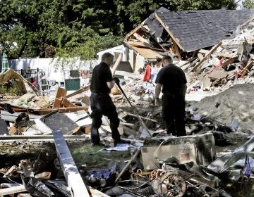 Fire investigators search the debris at a home where an explosion occurred following a gas line failure in September in Lawrence, Mass. (Charles Krupa/AP)