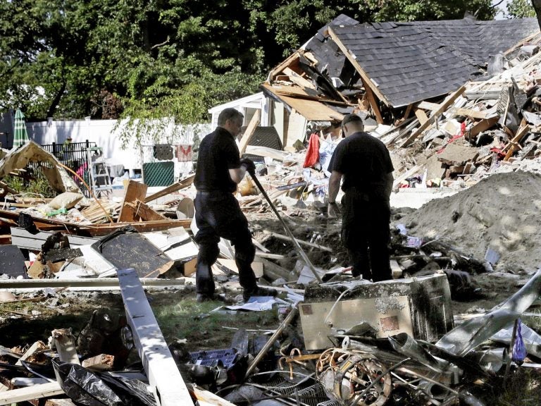 Fire investigators search the debris at a home where an explosion occurred following a gas line failure in September in Lawrence, Mass. (Charles Krupa/AP)