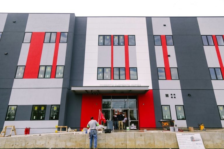 Construction workers put finishing touches on Roberto Clemente Homes. LISC provided financing for the project, developed by Esperanza. (Courtesy of Esperanza)