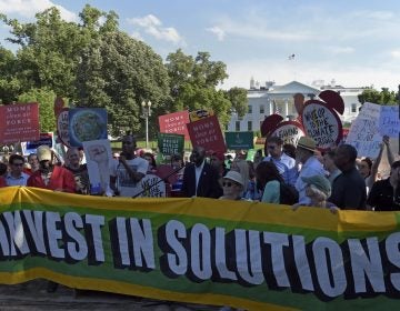 Activists gather outside the White House in Washington, Thursday, June 1, 2017, to protest President Donald Trump's decision to withdraw the Unites States from the Paris climate change accord. (Susan Walsh/AP Photo)