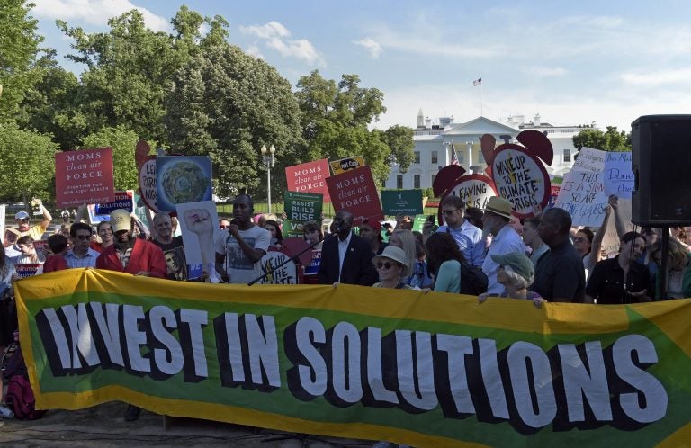 Activists gather outside the White House in Washington, Thursday, June 1, 2017, to protest President Donald Trump's decision to withdraw the Unites States from the Paris climate change accord. (Susan Walsh/AP Photo)