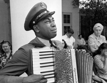 U.S. Navy CPO Graham Jackson, with tears of grief, plays 