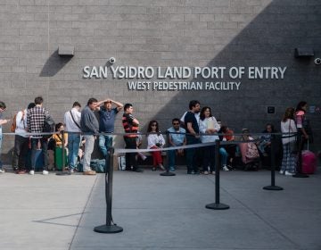 People wait in line outside the San Ysidro Port of Entry, between Tijuana, Mexico, and San Diego, Calif., in October.