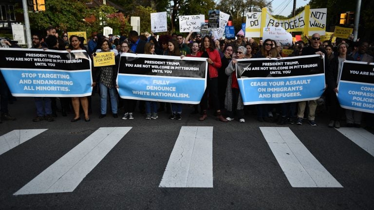 People protesting against President Trump gather near the Tree of Life Congregation on Wednesday in Pittsburgh, Pa. (Brendan Smialowski/AFP/Getty Images)