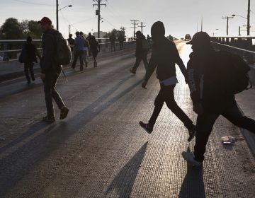 Members of the migrant caravan walk to make requests for political asylum at the U.S.-Mexico border last week in Tijuana, Mexico (John Moore/Getty Images)
