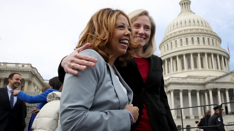 Newly elected members of the House of Representatives Lucy McBath and Abigail Spanberger meet in front of the U.S. Capitol. Both women represent newly Democratic suburban districts. (Win McNamee/Getty Images)