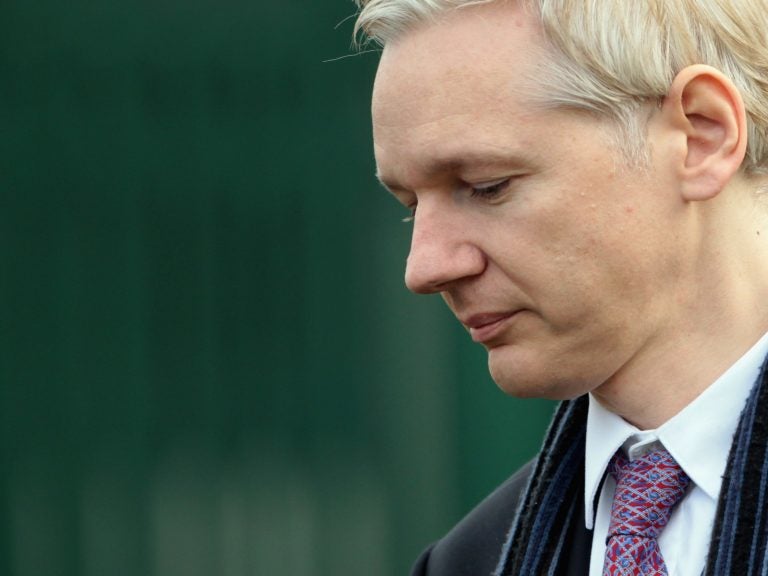 WikiLeaks founder Julian Assange could soon be facing criminal charges from the Department of Justice, according to language discovered in an unrelated court document by terrorism researcher Seamus Hughes. (Dan Kitwood/Getty Images)