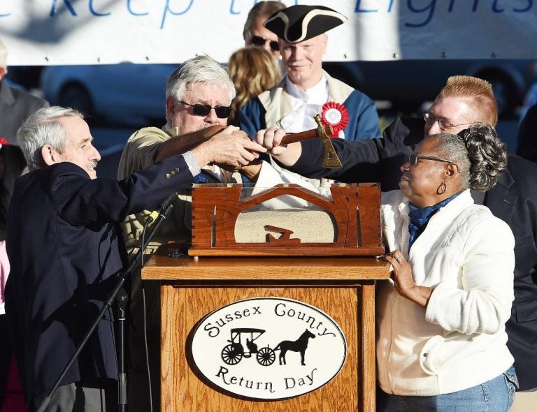Officials bury the hatchet at Return Day in Georgetown, Delaware. The ceremony symbolizes the end of political hostilities in the First State. (Chuck Snyder/for WHYY)