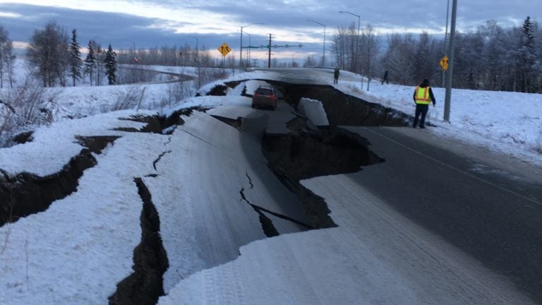 After an earthquake on Friday, a car is trapped in a crumbled section of off-ramp from Minnesota Drive, a major road in Anchorage, Alaska.
(Nathaniel Herz/Alaska Public)