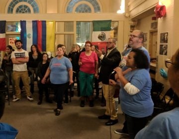 Volunteers with Make the Road Action in Pa. celebrate Democratic wins at the organization's office in Reading on November 6, 2018. (Rachel McDevitt/WITF)