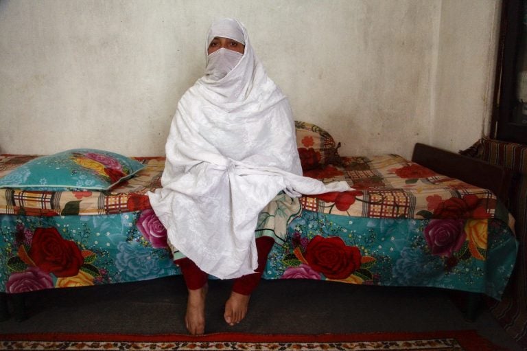 Mehnaz sits inside her home in Abbottabad, northern Pakistan. She has one son and six daughters. She has also had three abortions, fearing she would have more girls. (Diaa Hadid/NPR)