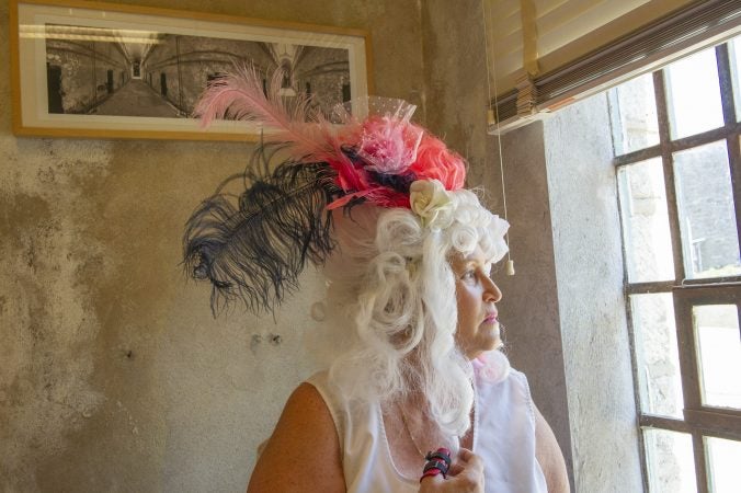 For nearly a quarter century, Terry McNally has played Marie Antoinette for Philadelphia's Bastille Day satirical celebration in the city's Fairmount section. She put her wig on for the last time July 14, 2018, after the Eastern State Penitentiary announced that it would no longer sponsor the event. (Jonathan Wilson for WHYY)