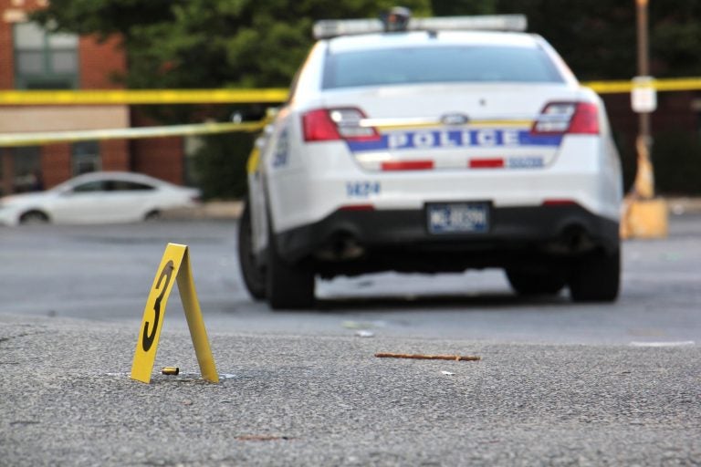 Police investigate a drive-by shooting in Germantown on Oct. 3, 2018. Five young men aged 19 to 23 were shot. One died. (Emma Lee/WHYY)