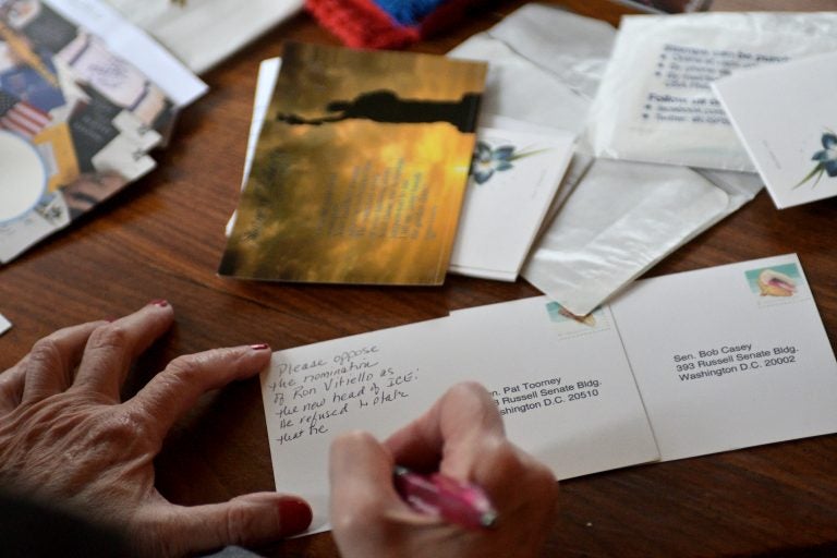 Postcards addressed to Pa. senators Pat Toomey and Bob Casey are written by an activist postcard writer, at a Mt Airy home (Bastiaan Slabbers for WHYY)