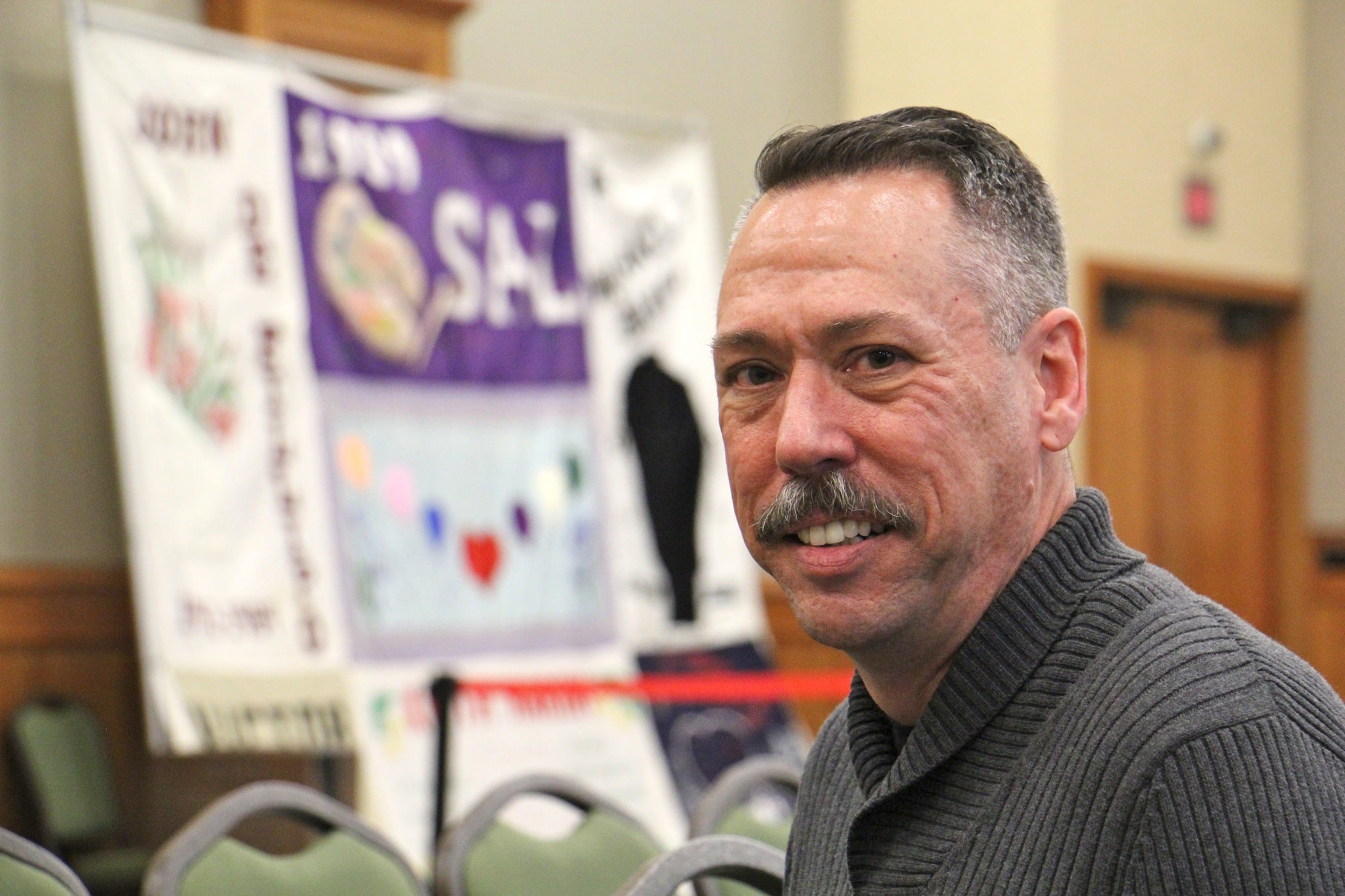 Robb Reichard, executive director of the AIDS Fund, gets ready to speak at Rutgers Camden on World AIDS Day.