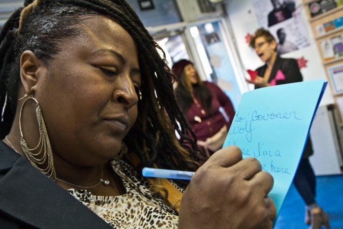 Latyra Blake was once incarcerated. She writes a holiday card to Governor Wolf asking him to end strict DOC mail policies. (Kimberly Paynter/WHYY)