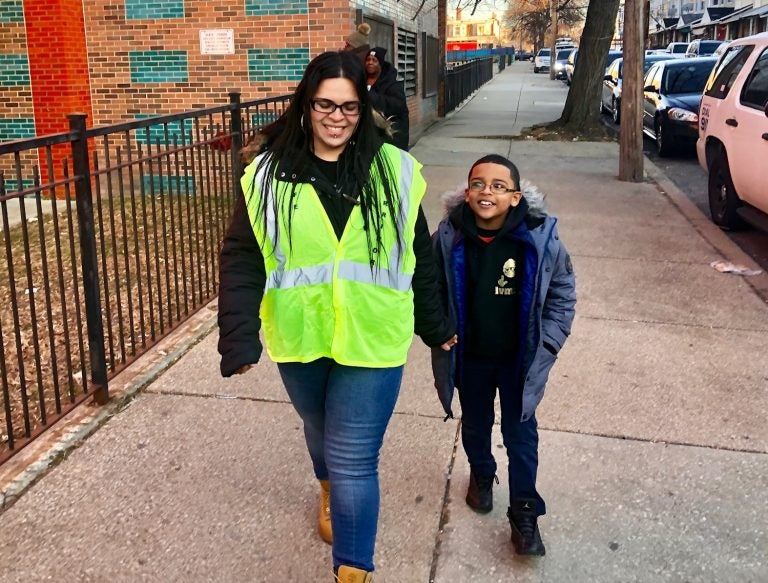 Dalia Burgos and her son Albert walk to Lewis Elkin School in Kensington. (Emma Lee/WHYY)