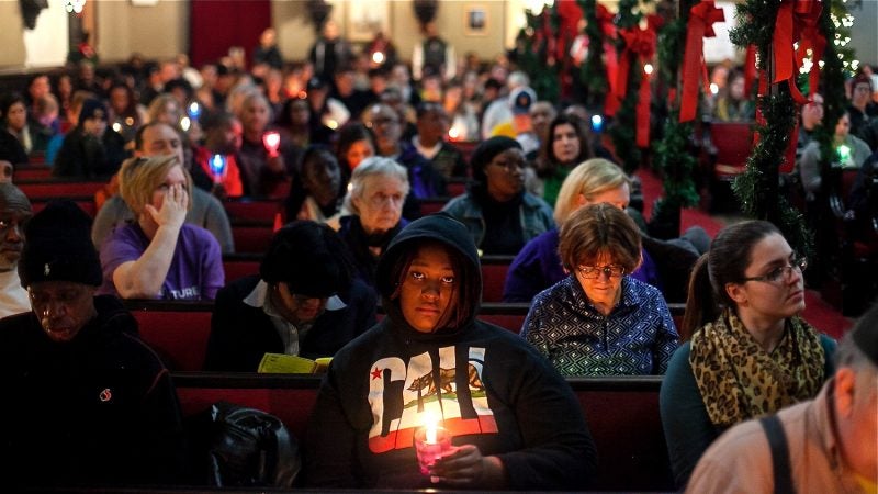 Philadelphians, some formerly and currently homeless, attended a Homeless Memorial Day service at Arch Street United Methodist Church Thursday evening. (Brad Larrison for WHYY)