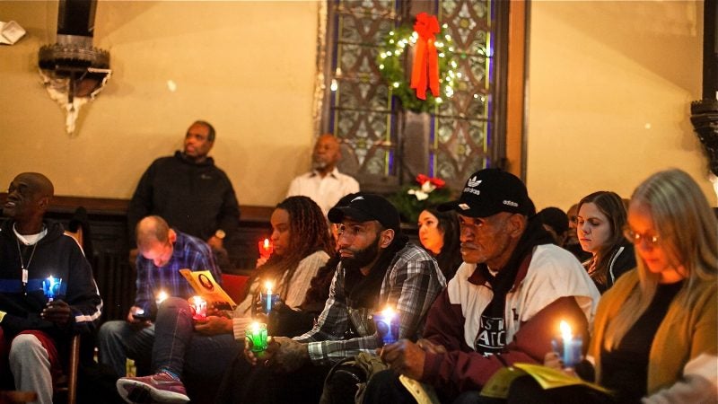 Philadelphians, some formerly and currently homeless, attended a Homeless Memorial Day Service at Arch Street United Methodist Church Thursday evening. (Brad Larrison for WHYY)