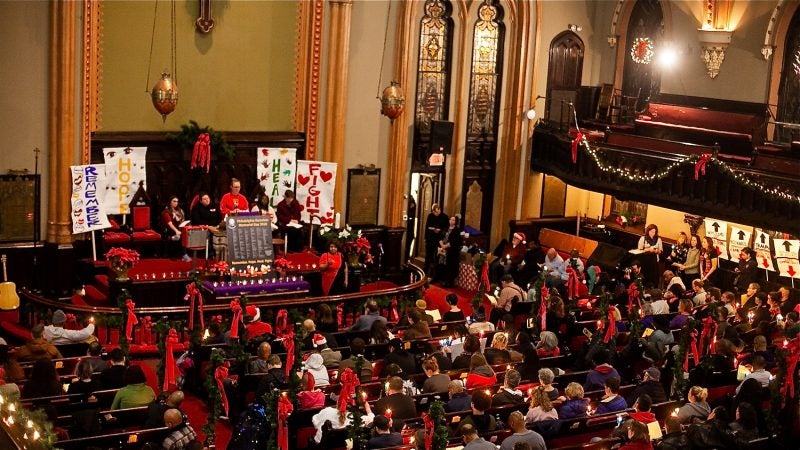 Hundreds of Philadelphians, some formerly and currently homeless, attend a Homeless Memorial Day service at Arch Street United Methodist Church Thursday evening. (Brad Larrison for WHYY)