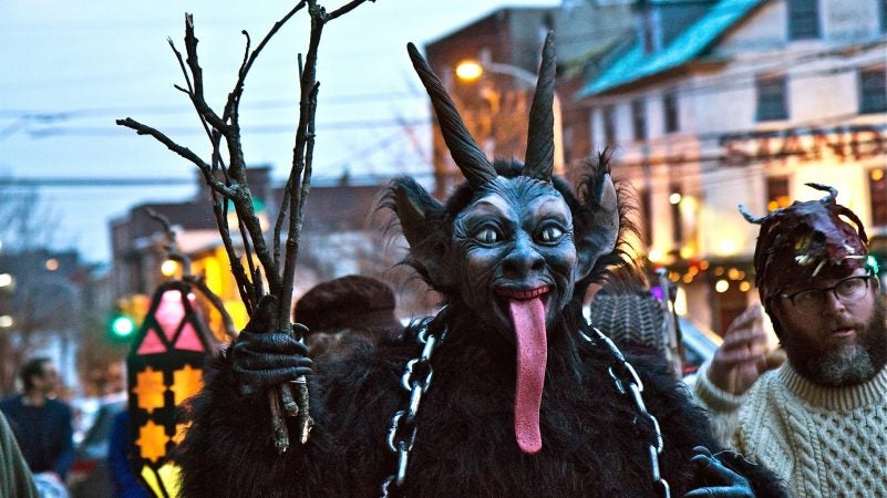 Costumed revelers march through Northern Liberties for the 2018 Parade of Spirits on Dec. 15, 2018, a celebration of the darker side of the winter holidays. (Kimberly Paynter/WHYY)