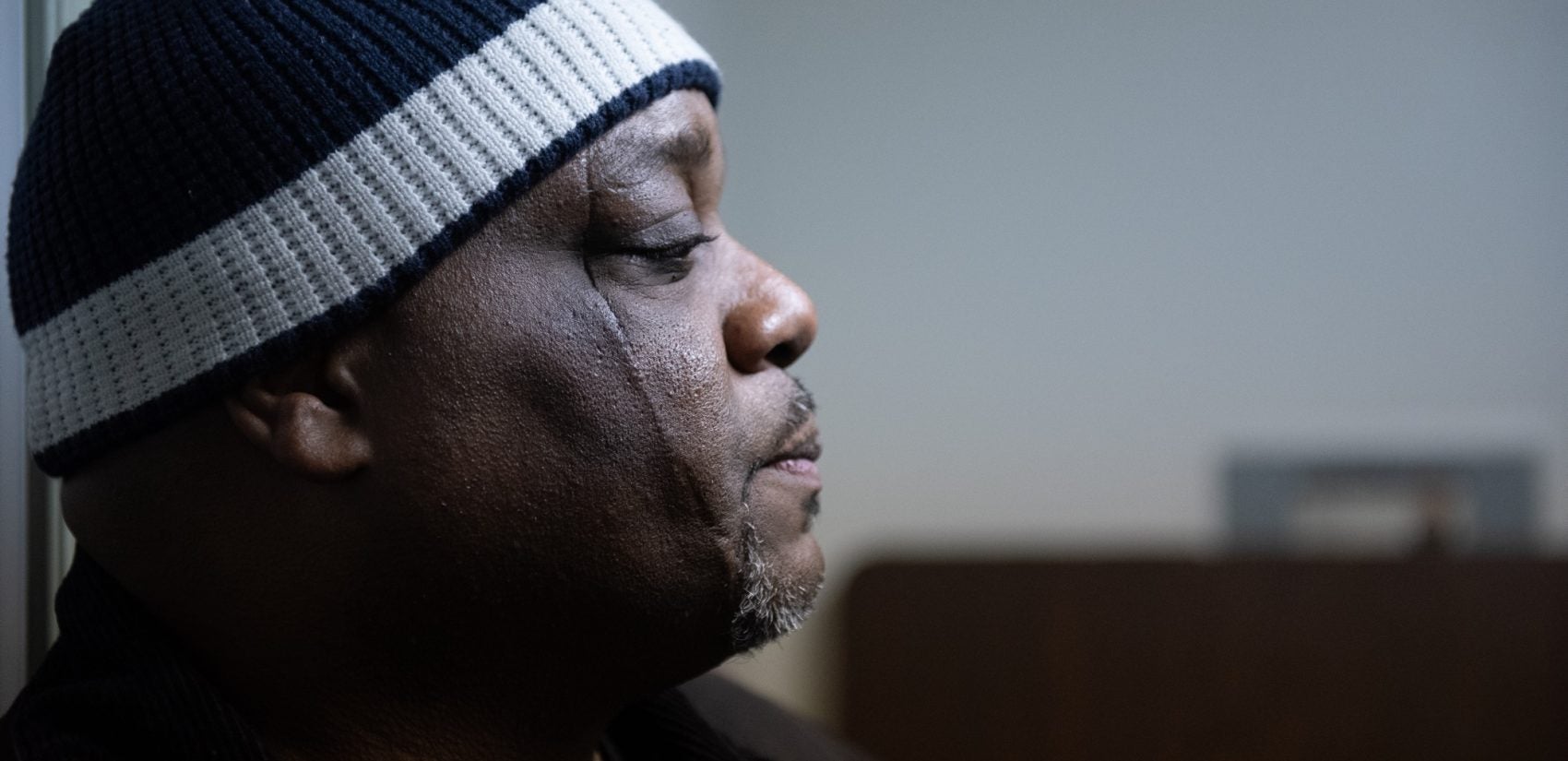 Shondell Revell, Executive Director for the Office of Violence Prevention, meets with members of the Community Crisis Intervention Program before they head into North Philadelphia neighborhoods, where they will engage with communities in an effort to de-escalate tensions and reduce violence. (Kriston Jae Bethel for WHYY)