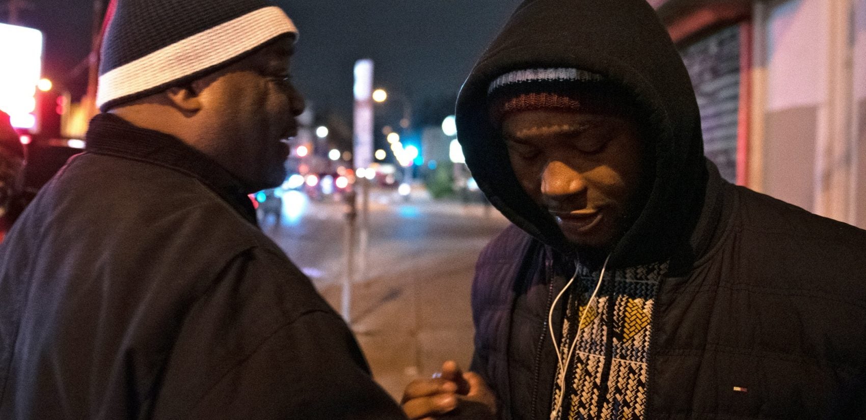 Shondell Revell says goodbye to Omar Smith, before he's given a ride home by CCIP members. (Kriston Jae Bethel for WHYY)