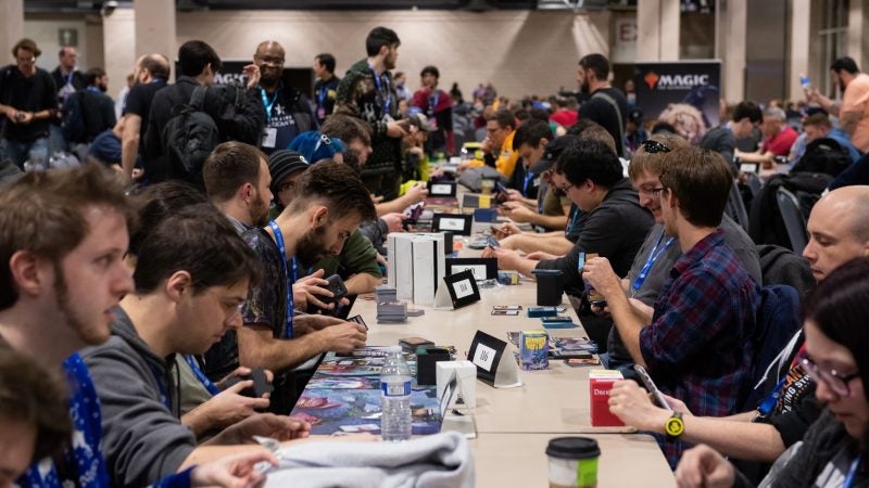 Competitors prepare their card decks during a Magic: The Gathering tournament at PAX Unplugged. (Kriston Jae Bethel for WHYY)