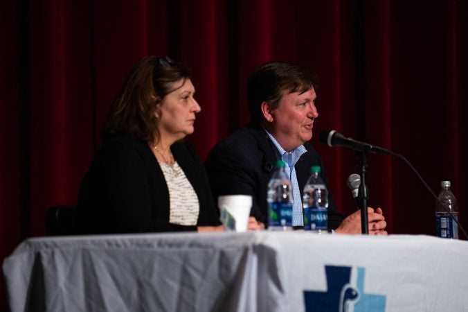 Dr. Sharon Watkins, from the Pennsylvania Department of Health, and Dr. Christopher Reh, from the Agency for Toxic Substances and Disease Registry, answer quetions about the findings of an initial study on the prevalence of perfluoroalkyl and polyfluoroalkyl substances (PFAS) at Upper Dublin High School in Fort Washington, Pa. The study tested the blood of residents in Warrington, Warminster and Horsham areas, where the chemicals are believed to have entered the drinking water from local military bases. (Kriston Jae Bethel for WHYY)