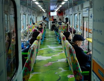 The interior of the DMZ train, a three-car tourist train. It is decorated with words such as 