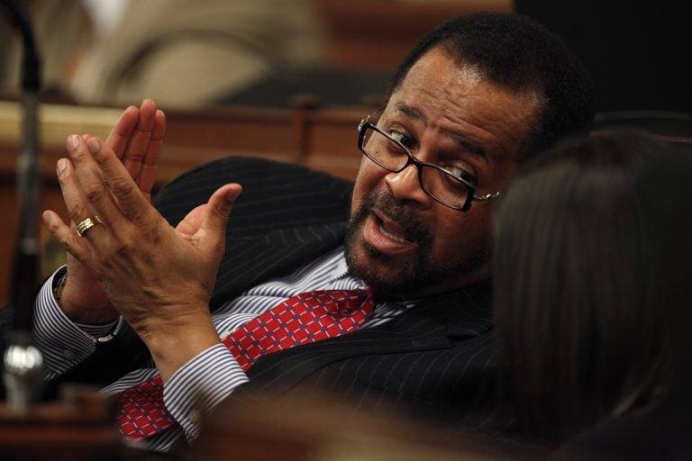 In this file photo, then-Pennsylvania Rep. Jewell Williams, D-Philadelphia, talks with a colleague as he sits at his desk on the floor of the Pennsylvania House of Representatives in Harrisburg, Pa., Wednesday, Jan. 6, 2010. (Carolyn Kaster/AP Photo)