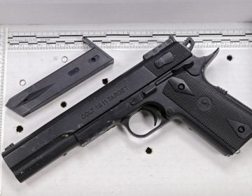 In this Nov. 26, 2014, file photo, a fake handgun resembling a Colt 1911 pistol, taken from Tamir Rice after he was fatally shot by Cleveland police, is displayed after a news conference in Cleveland. (Mark Duncan/AP Photo, File)