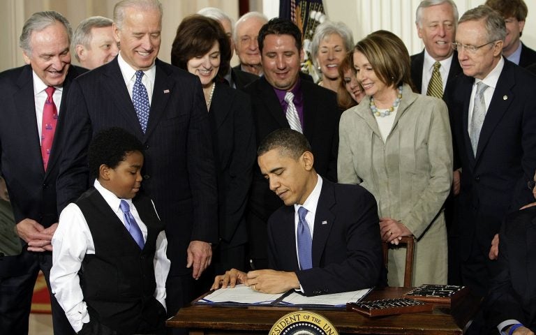 FILE - In this Tuesday, March 23, 2010 file photo, President Barack Obama signs the Patient Protection and Affordable Care Act in the East Room of the White House in Washington. (AP Photo/J. Scott Applewhite)