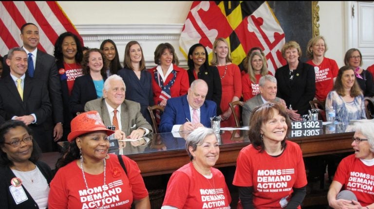 Maryland Gov. Larry Hogan signs legislation to enable judges to order people to temporarily give up their firearms if they are found to pose an immediate danger, one of more than 200 bills he signed on Tuesday, April 24, 2018, in Annapolis, Md. Hogan also signed a bill to ban bump stocks, which can increase a semi-automatic rifle's firing rate, as well as a bill to require convicted domestic abusers to surrender guns to law enforcement or a firearms dealer. ( Brian Witte / The Associated Press)