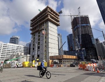 In this photo taken Wednesday, Oct. 10, 2018, construction goes on at the site of a new Amazon building, where space will be provided for a Mary's Place Family Shelter, in downtown Seattle. Amazon.com boss Jeff Bezos' plan to fund preschools in poor communities puts him in the company of America's richest people who have dedicated some of their wealth to education, a legacy that has long challenged the role of poverty and capitalism in philanthropy. (Elaine Thompson/AP)