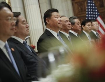 China's President Xi Jinping, (center), and members of his official delegation, listen to President Donald Trump speak during their bilateral meeting at the G20 Summit, Saturday, Dec. 1, 2018 in Buenos Aires, Argentina. (AP Photo/Pablo Martinez Monsivais)