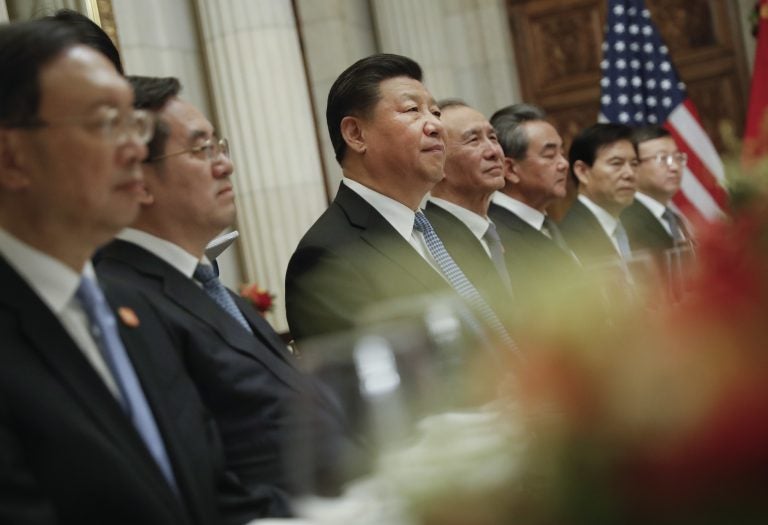 China's President Xi Jinping, (center), and members of his official delegation, listen to President Donald Trump speak during their bilateral meeting at the G20 Summit, Saturday, Dec. 1, 2018 in Buenos Aires, Argentina. (AP Photo/Pablo Martinez Monsivais)