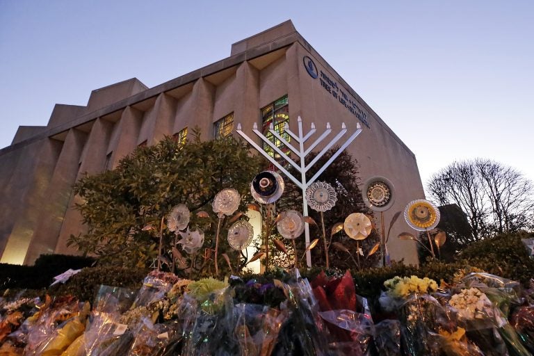 A menorah is installed outside the Tree of Life Synagogue in preparation for a celebration service at sundown on the first night of Hanukkah, Sunday, Dec. 2, 2018 in the Squirrel Hill neighborhood of Pittsburgh. A gunman shot and killed 11 people while they worshipped Saturday, Oct. 27, 2018 at the temple. (Gene J. Puskar/AP Photo)