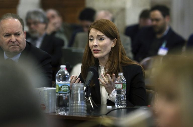 Katie Brennan, the chief of staff at the New Jersey Housing and Mortgage Finance Agency, answers a question as she testifies before the Select Oversight Committee at the Statehouse, Tuesday, Dec. 4, 2018, in Trenton, N.J. Brennan says Democratic Gov. Phil Murphy's campaign staff didn't take her sexual assault allegations seriously. (Mel Evans/AP Photo)