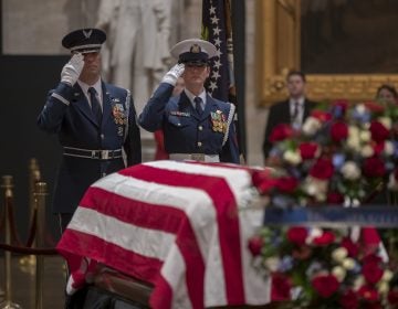 A final salute is rendered by the honor guard standing watch over the flag-draped casket of the late president, George H.W. Bush, as the public viewing comes to an end at the U.S. Capitol Rotunda, Wednesday, Dec. 5, 2018. (AP Photo/J. Scott Applewhite)